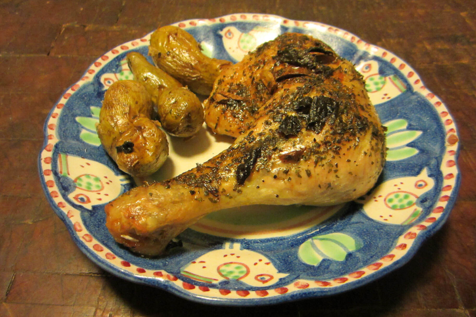 Plate of garlic herb chicken with potatoes