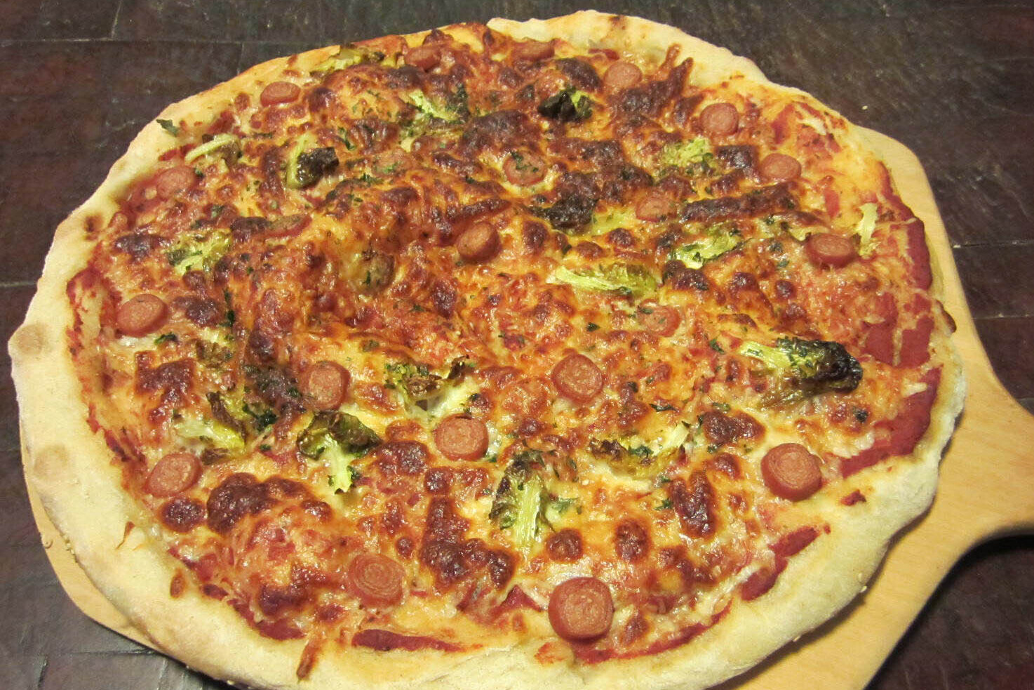 A whole pepperoni and broccoli pizza