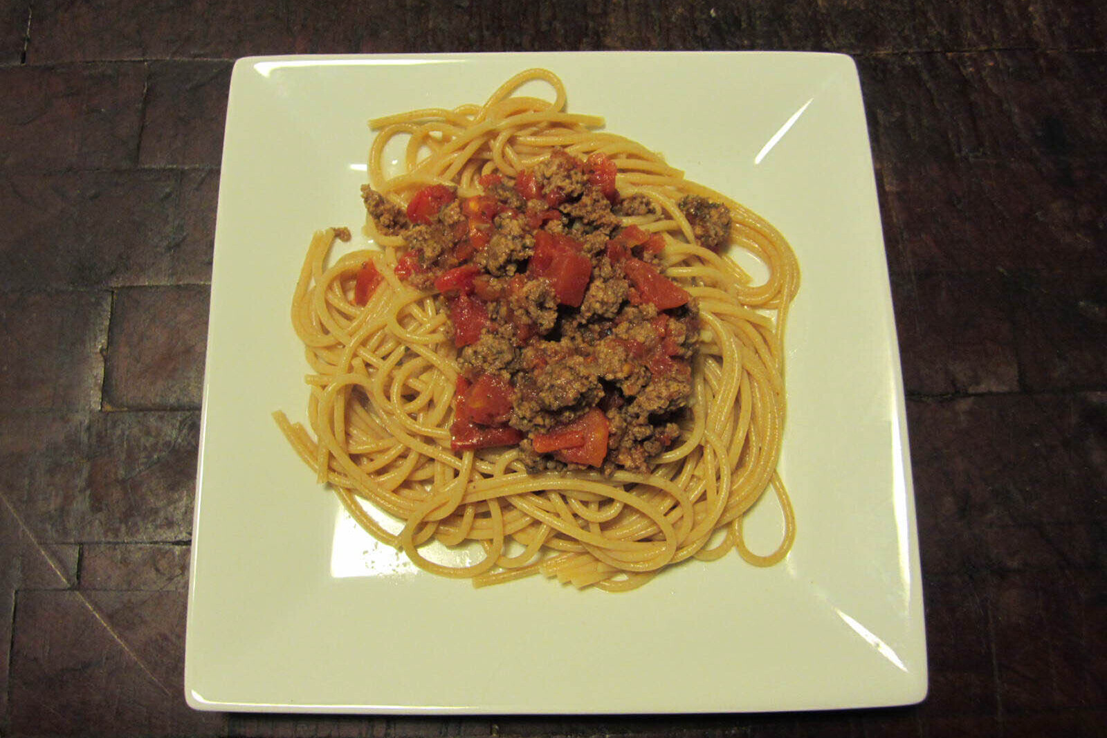 A plate of whole wheat spaghetti with meat sauce