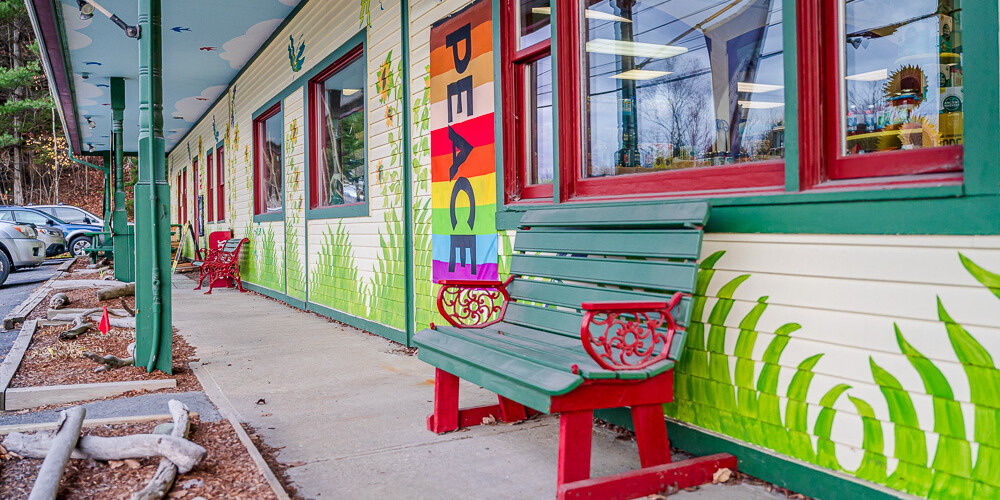 store front with benches at sunflower natural foods