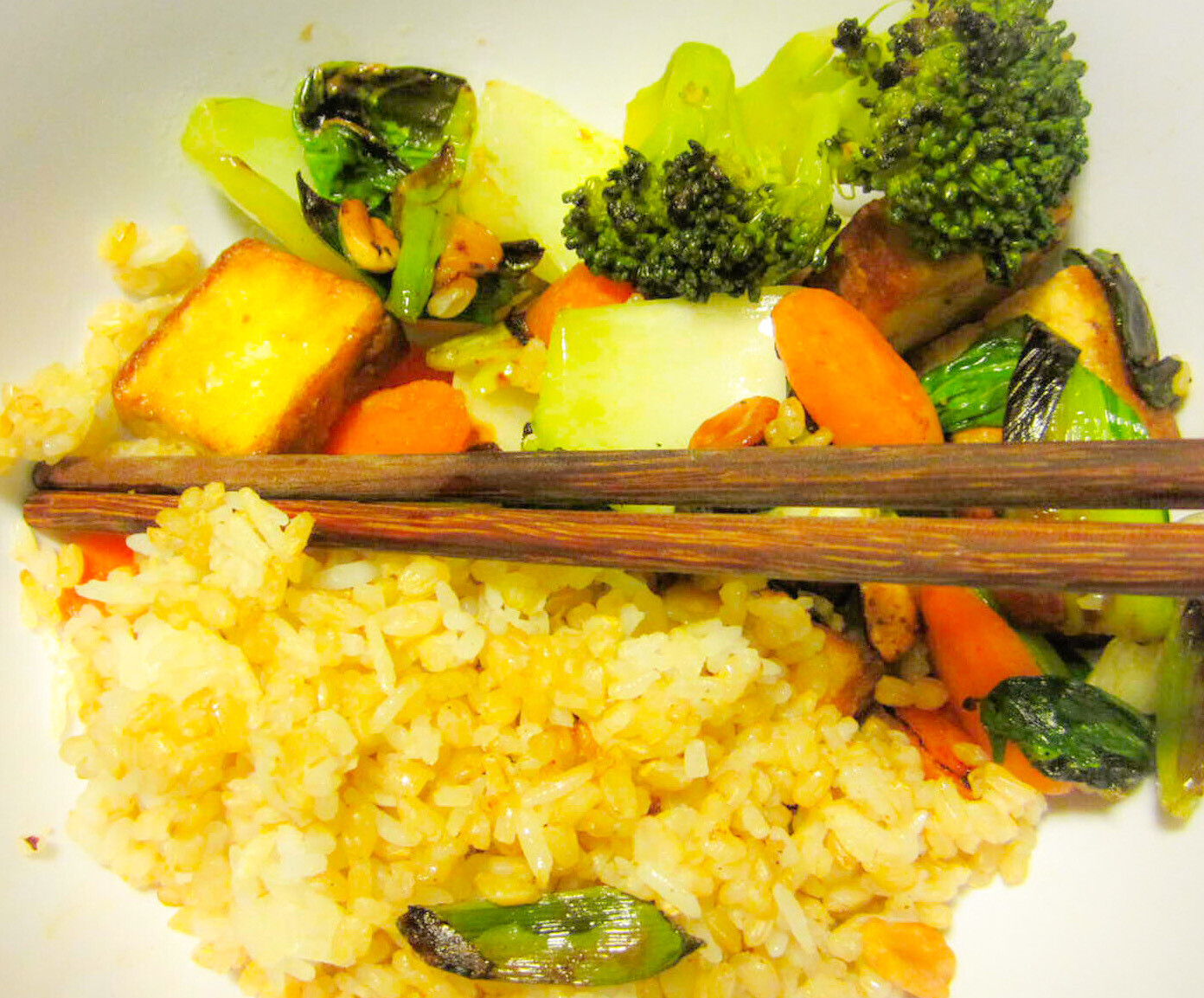 veggie stir fry with rice and chopsticks