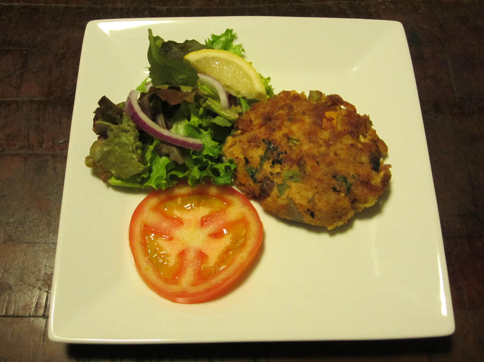 Tuna vegetable burger with tomato and lettuce