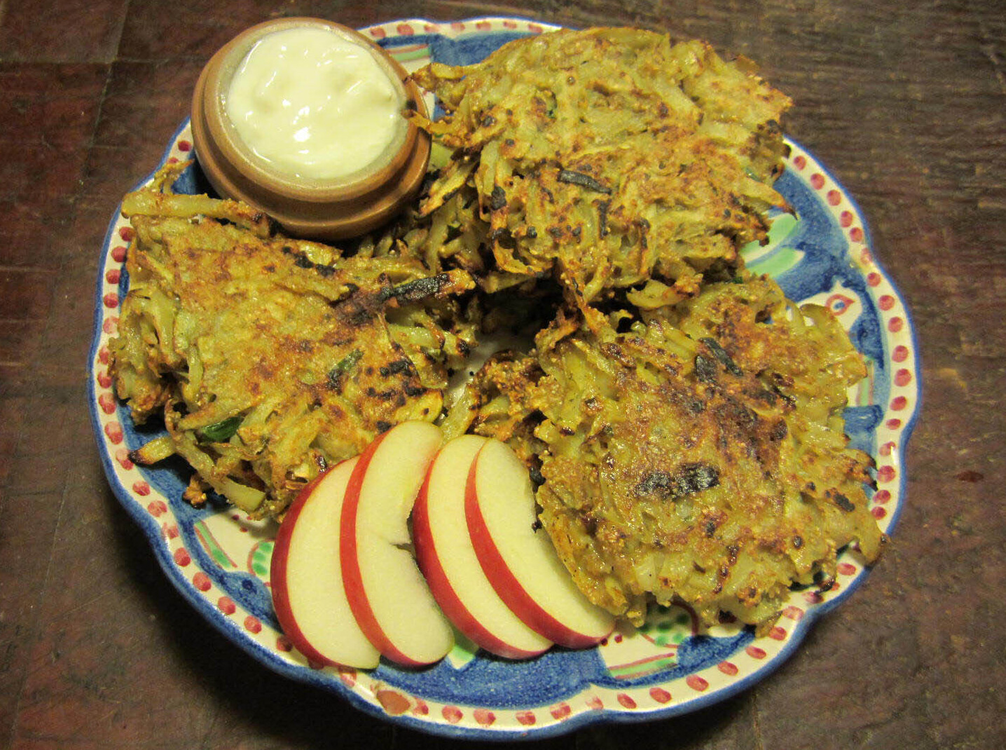 Potato chive pancakes with sliced apples and plain yoghurt